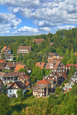 Buy stock photo Houses, trees in village or countryside landscape, travel and adventure location with hill, nature and buildings. Neighborhood, real estate and property with architecture  for holiday in Germany