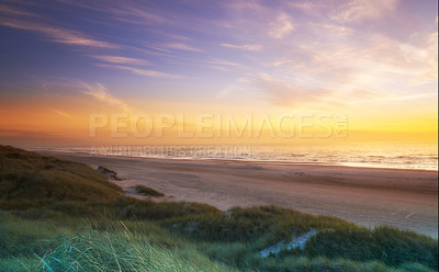 Buy stock photo A beautiful sunrise over a tranquil beach scene