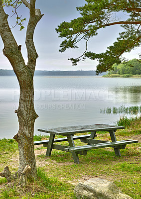 Buy stock photo Lake, bench and summer with nature, trees and environment with grass and earth with blue sky. Empty, seating and water with fresh air and forest with plants and landscape with countryside and ecology