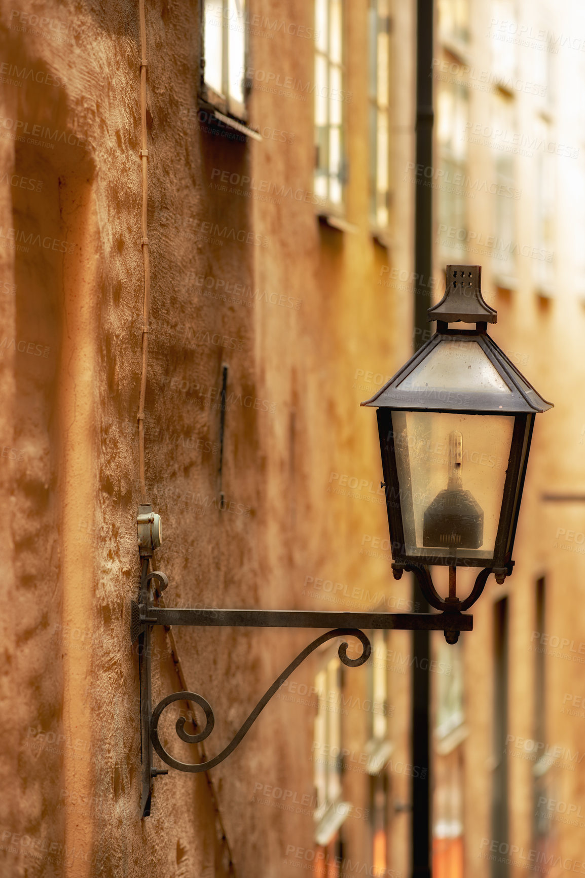 Buy stock photo Travel, architecture and lamp on vintage building in old town with history, culture or holiday destination in Sweden. Vacation, landmark and antique lantern in Stockholm with retro light ancient city