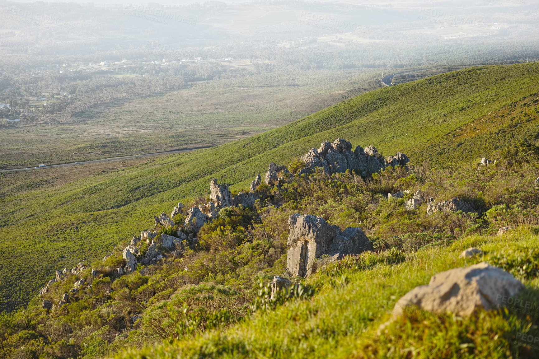 Buy stock photo Mountain, fog and natural landscape with grass, rocks and calm field for travel location. Nature, hill and sustainable environment with earth, peace and holiday destination with planet conservation