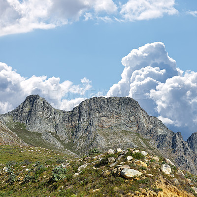 Buy stock photo Mountain, blue sky and travel location with clouds, summer and journey in natural landscape. Landmark, nature and environment for outdoor adventure, explore and holiday destination in South Africa.