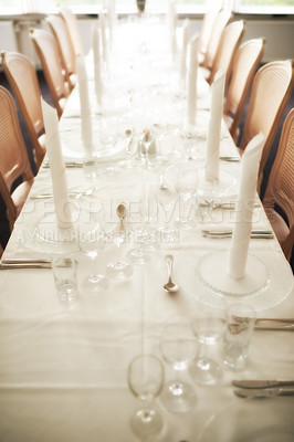 Buy stock photo Empty fine dining room table arranged for dinner in fancy restaurant. Above view of glass dishes, cups, wineglasses, silverware and cutlery neatly organized for lunch. Seating in hospitality industry