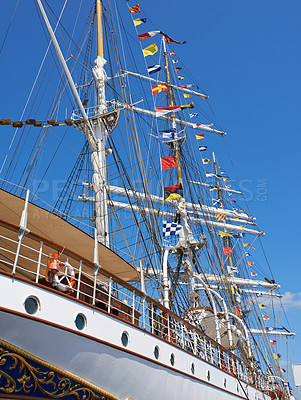 Buy stock photo Ship, water and harbor at sea to coast guard with landscape, blue sky and nautical flags for emergency sailing. Vessel, dock and ocean with safety for maritime, danger and patrol in morning or nature