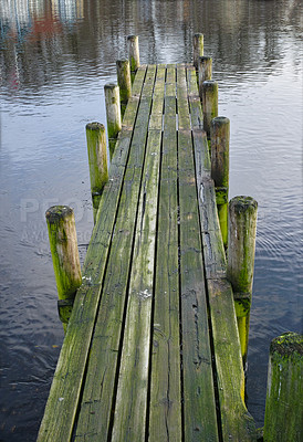 Buy stock photo Wood, bridge and lake in nature for travel, environment and camp destination for summer. Wooden pier, dock or path to water, peace and calm in location for adventure with perspective and background