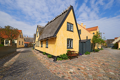 Buy stock photo House, road in village or countryside landscape, travel and adventure location with cobblestone path and buildings. Neighborhood, real estate and property with architecture  for holiday in Denmark