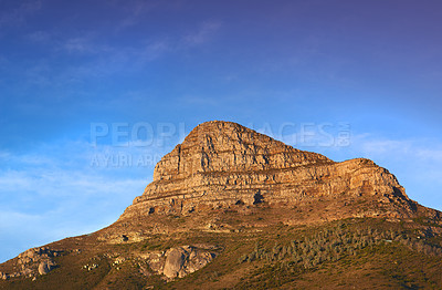 Buy stock photo Mountain, peak and natural landscape with blue sky, summer and calm cliff at tranquil travel location. Nature, evening and sustainable environment with earth, sunshine and serene hill in Cape Town