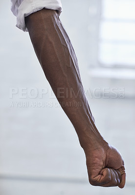 Buy stock photo Strong, person and vein from muscle in arm with fist for power in white background or fashion. African, hand and forearm of model with healthy fitness, wellness or muscular bodybuilder in office