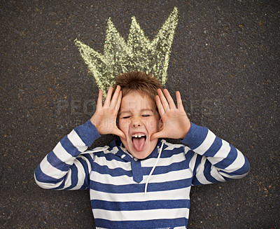 Buy stock photo Chalk art, funny face or boy with crown on floor for drawing, imagine or future fantasy on black background. King, emoji or kid with royalty, sketch prince or dream for school, project or assignment