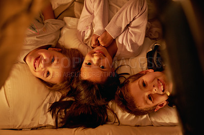 Buy stock photo Children, love and portrait of siblings in a bed with fun, support and trust while bonding at home together. Family, night and face of kids in a bedroom for evening games, playing or indoor camping