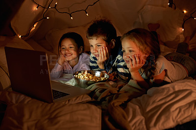 Buy stock photo Children, computer and watch in tent at night with movies, film or cartoons for holiday adventure or vacation. Young boy, girl or kids with lights, pillows and blanket at home on laptop for Netflix