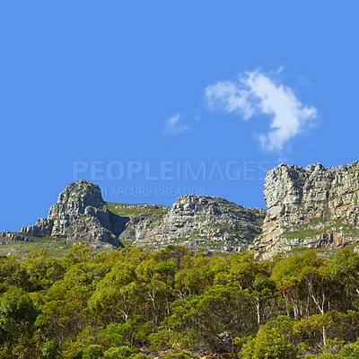 Buy stock photo Mountains, sunshine and blue sky with nature, clouds and stone with landscape and environment. Empty, rock and grass with flowers or countryside with summer and travel with holiday, journey or plants
