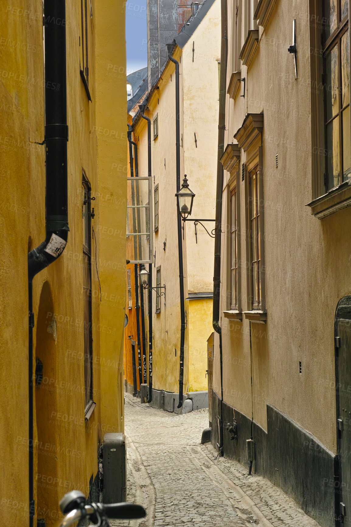 Buy stock photo Travel, architecture and alley in ancient town with history, culture or holiday destination in Sweden. Vacation, old buildings and antique stone street in Stockholm with cobble path in vintage city