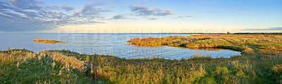 Buy stock photo Lake, grass and nature with landscape, horizon or sky in environment with sunshine in Jutland. Water, sea or field with clouds, sustainability or ecology for earth in summer at countryside in Denmark
