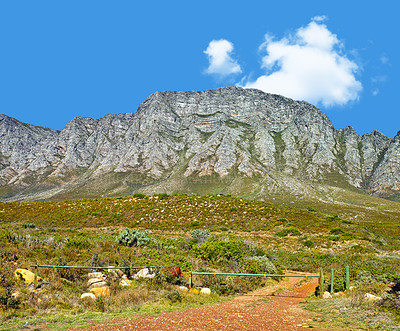 Buy stock photo Mountain, blue sky and hiking with travel location, journey and terrain in natural landscape. Nature, landmark and environment for outdoor adventure, explore and holiday destination in South Africa.