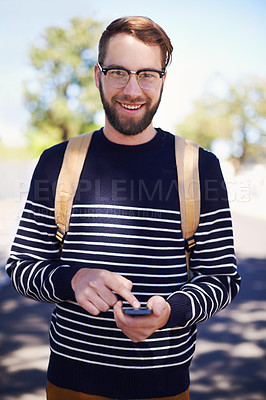 Buy stock photo Portrait, phone and man in outdoors for education, student and scrolling on university app or internet. College campus, male person and typing a message or check email, online and communication