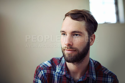 Buy stock photo Man, thinking and face for thought, happy and relax at home or indoor on weekend and alone. Young person, attractive or handsome for unwind, rest or chill in apartment or loft inside South Africa