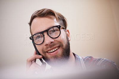 Buy stock photo Happy man, face and phone call with glasses for conversation, communication or networking at home. Young male person or freelancer with smile on mobile smartphone for friendly discussion at the house