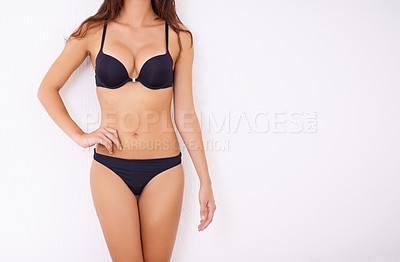 Buy stock photo Cropped shot of a young woman posing in her underwear