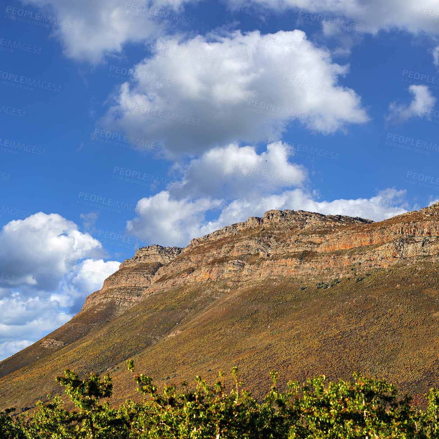 Buy stock photo Mountains, environment and blue sky with nature, clouds and sunshine with landscape and adventure. Empty, rock and grass with flowers or countryside with summer and travel with vacation or plants