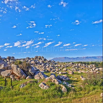 Buy stock photo Mountains, rocks and clouds in blue sky for travel, hiking and eco friendly tourism or explore with beautiful view. Background of landscape, environment and field in summer by countryside with mockup