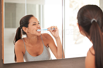 Buy stock photo Mirror, bathroom and woman with toothbrush for wellness, oral hygiene and dental care in home. Toothpaste, healthcare and reflection of person brushing teeth for whitening, cleaning and grooming