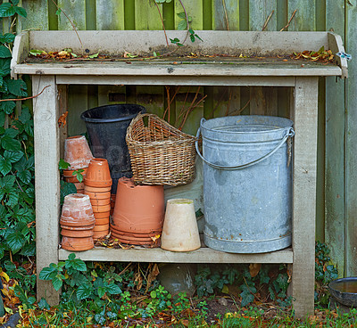 Buy stock photo Stacks of flower pots in a gardener's corner
