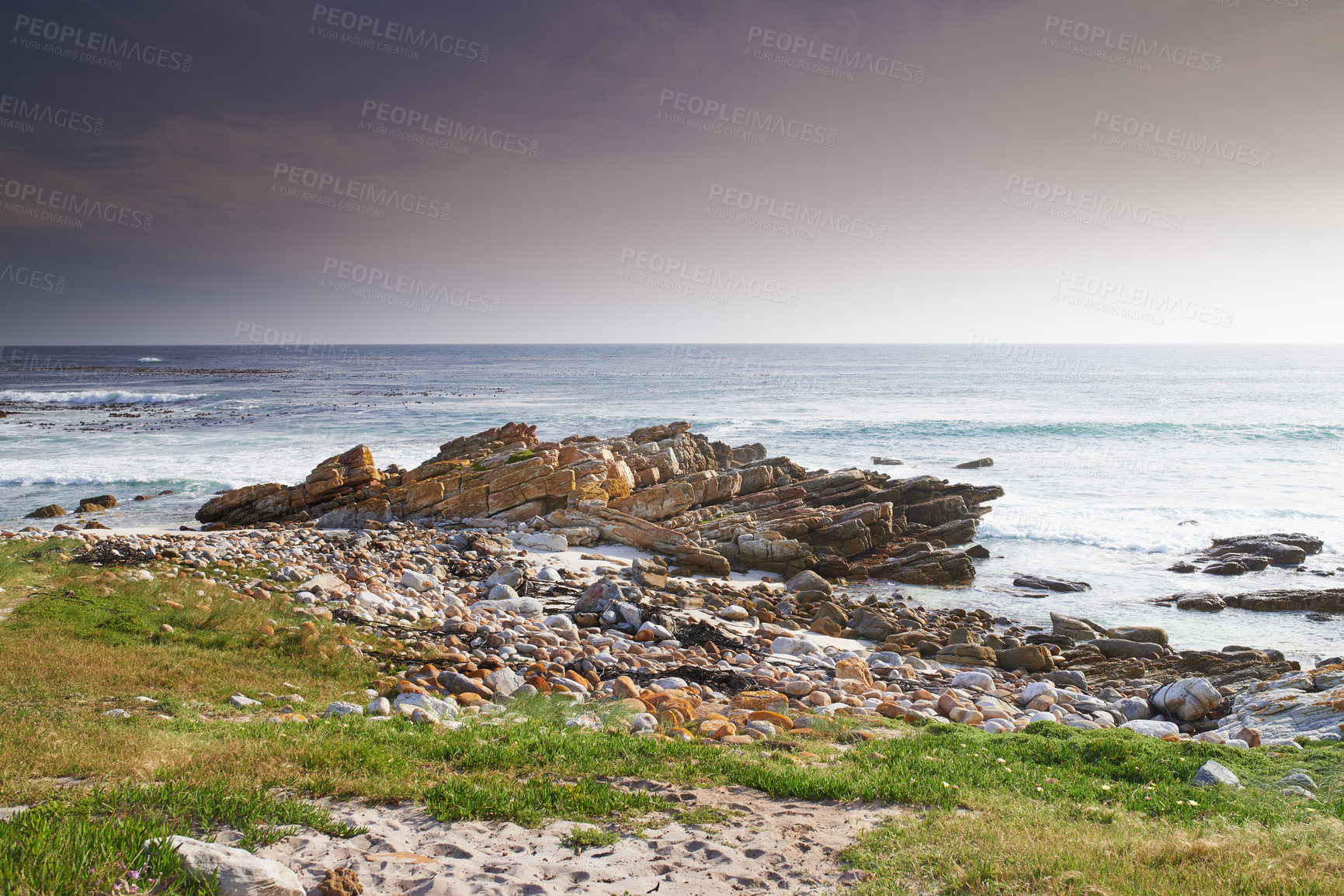 Buy stock photo A rocky coastline in the Western Cape, South Africa on a hot summer day. Clear skies and beaches, a perfect getaway filled with self care resorts and wellness outdoor activities with tropical weather