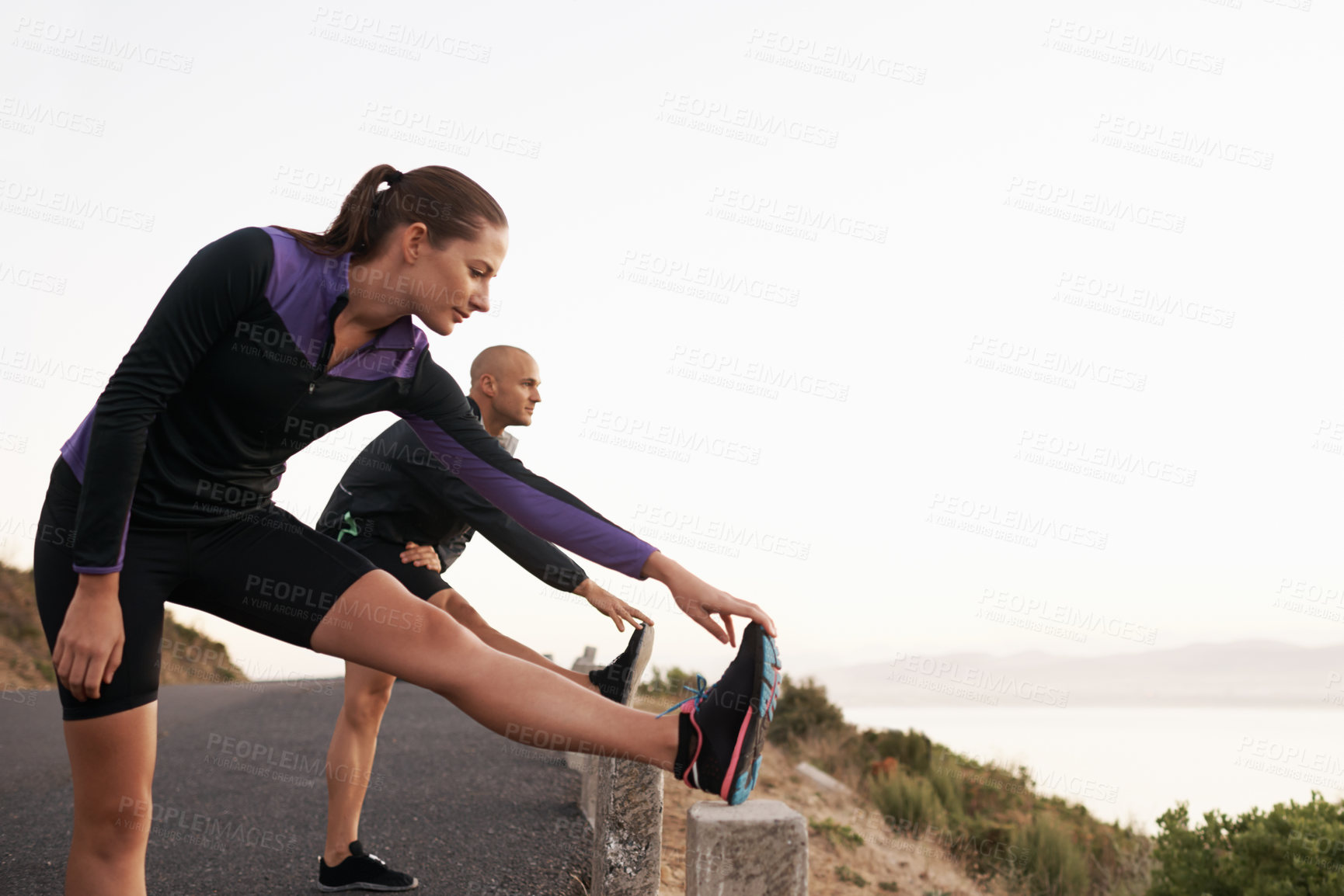 Buy stock photo Mountain, stretching and woman with man for fitness, workout coach or help for healthy body. Exercise, wellness and girl runner with personal trainer in muscle warm up for outdoor morning training.