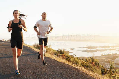 Buy stock photo Morning, fitness and couple running as exercise or workout for health and wellness together in sunrise. Sport, man and woman runner run with athlete as training listening to sports music for energy