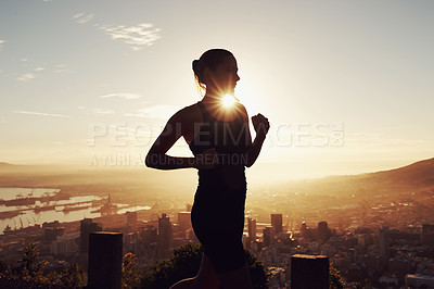 Buy stock photo Fitness, running and woman in silhouette on mountain for health, wellness and strong body development. Workout, exercise and girl runner on sunset path in nature for training, performance and city