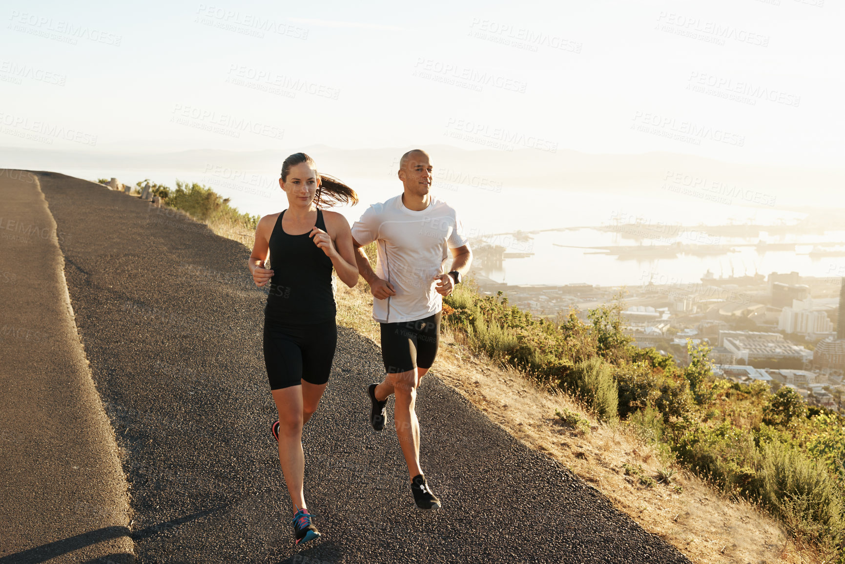 Buy stock photo Road, running and woman with man for fitness, workout coach and race for healthy body. Exercise, wellness and girl runner with personal trainer, marathon and sports for outdoor training in morning.