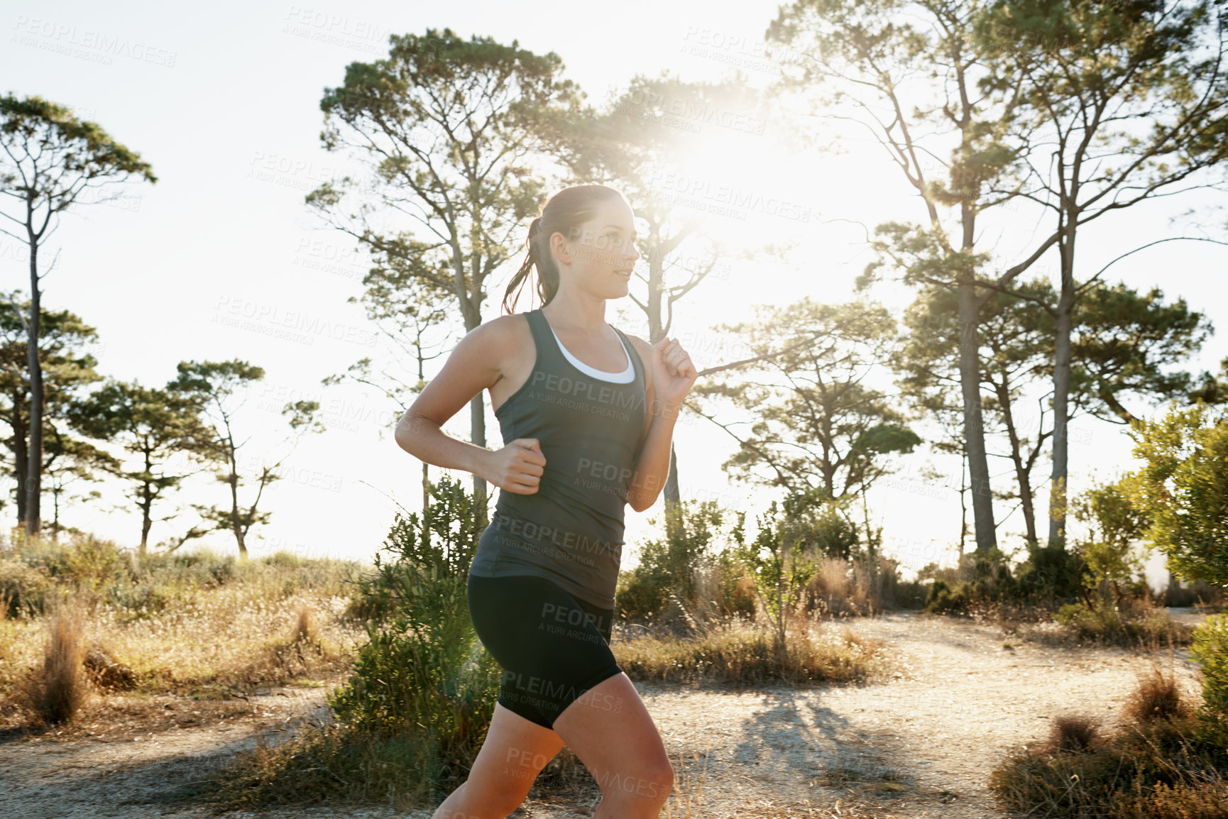 Buy stock photo Shot of a young runner training outdoors