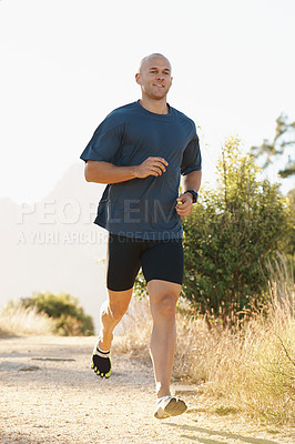 Buy stock photo Running, man and marathon on trail with fitness for sport, training and exercise for competition on mountain. Athlete, person and runner with wellness, happiness or cardio for healthy body in Denmark