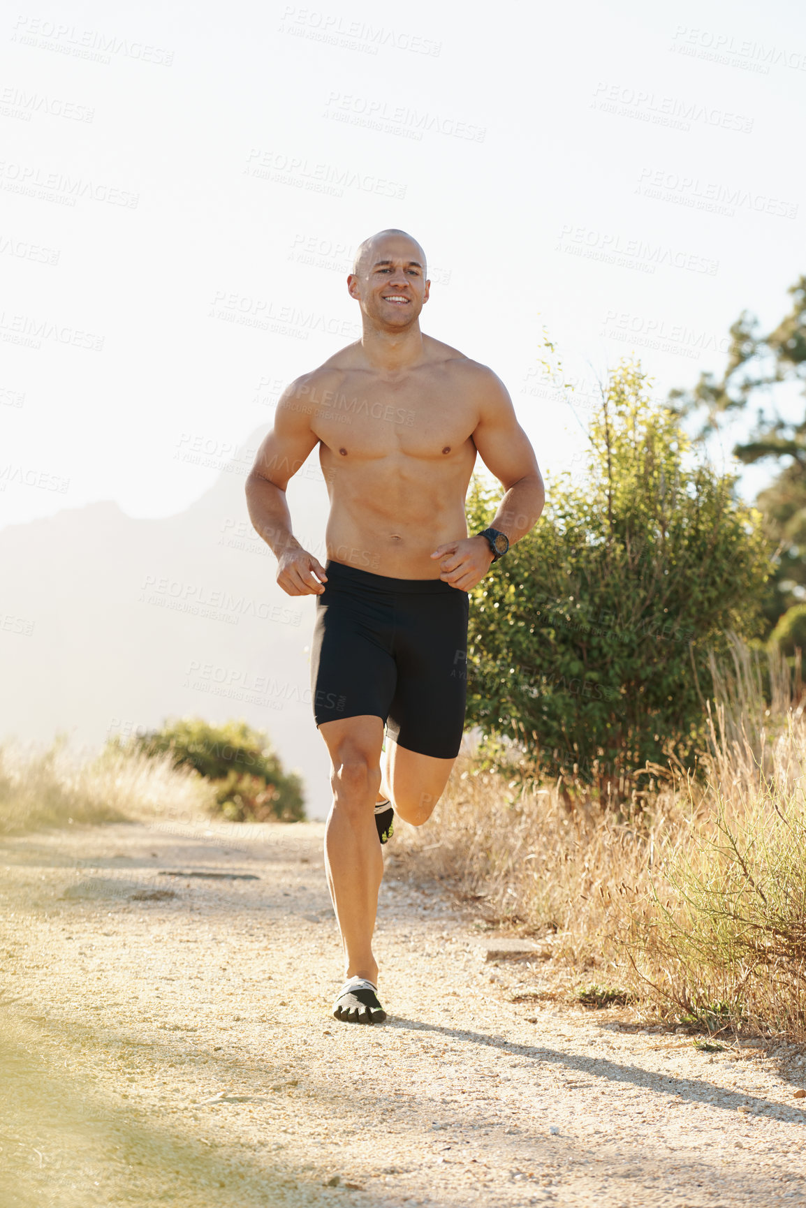 Buy stock photo Man, topless and running outdoor for fitness, cardio and health in park with fresh air and training for marathon. Sports, exercise and athlete in nature for workout, wellness and endurance for body