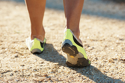 Buy stock photo Person, runner and athlete with shoes for running, marathon or sports on dirt road or terrain. Closeup of athletic feet, footwear or getting ready for cardio, training or outdoor exercise and workout