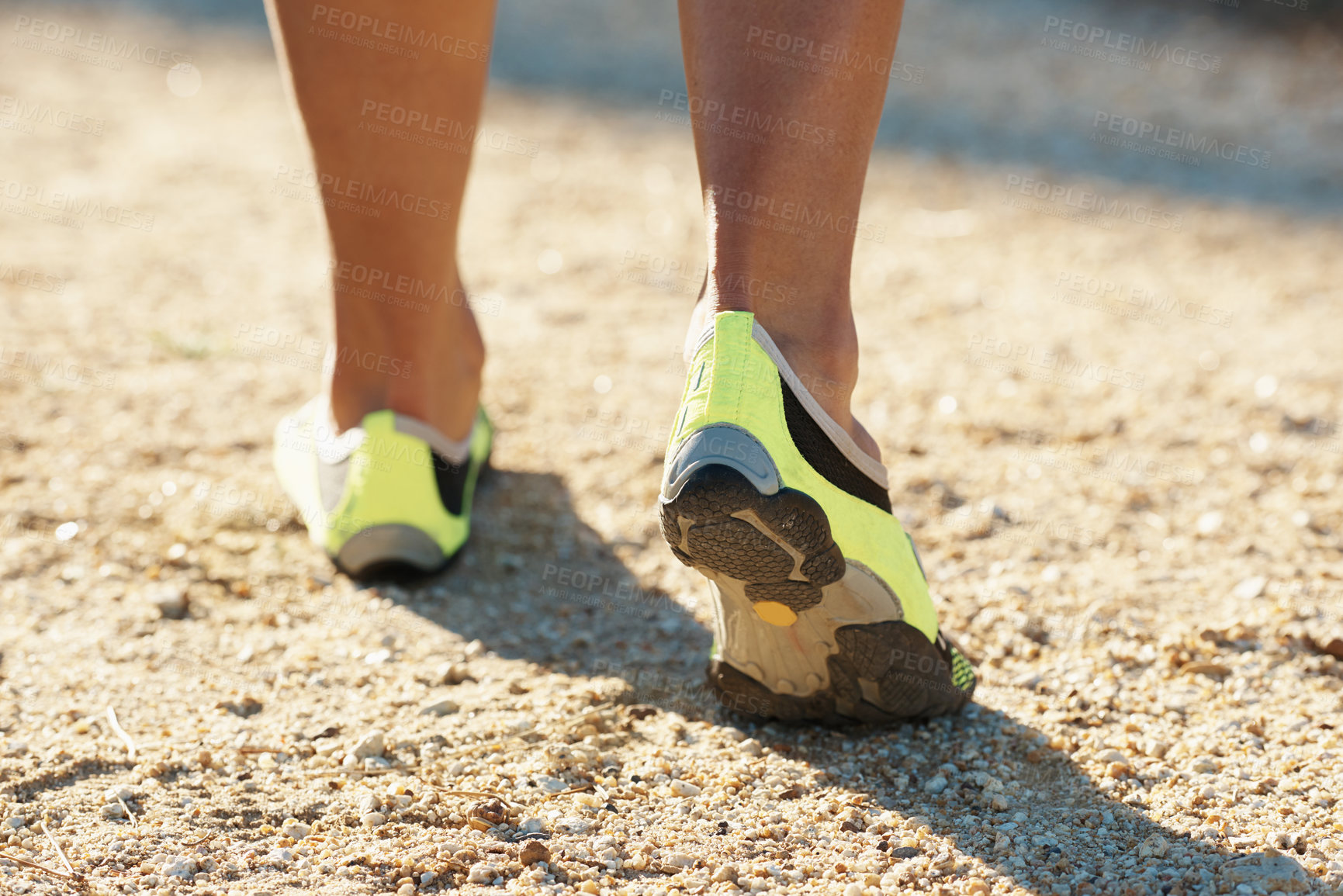 Buy stock photo Person, runner and athlete with shoes for running, marathon or sports on dirt road or terrain. Closeup of athletic feet, footwear or getting ready for cardio, training or outdoor exercise and workout