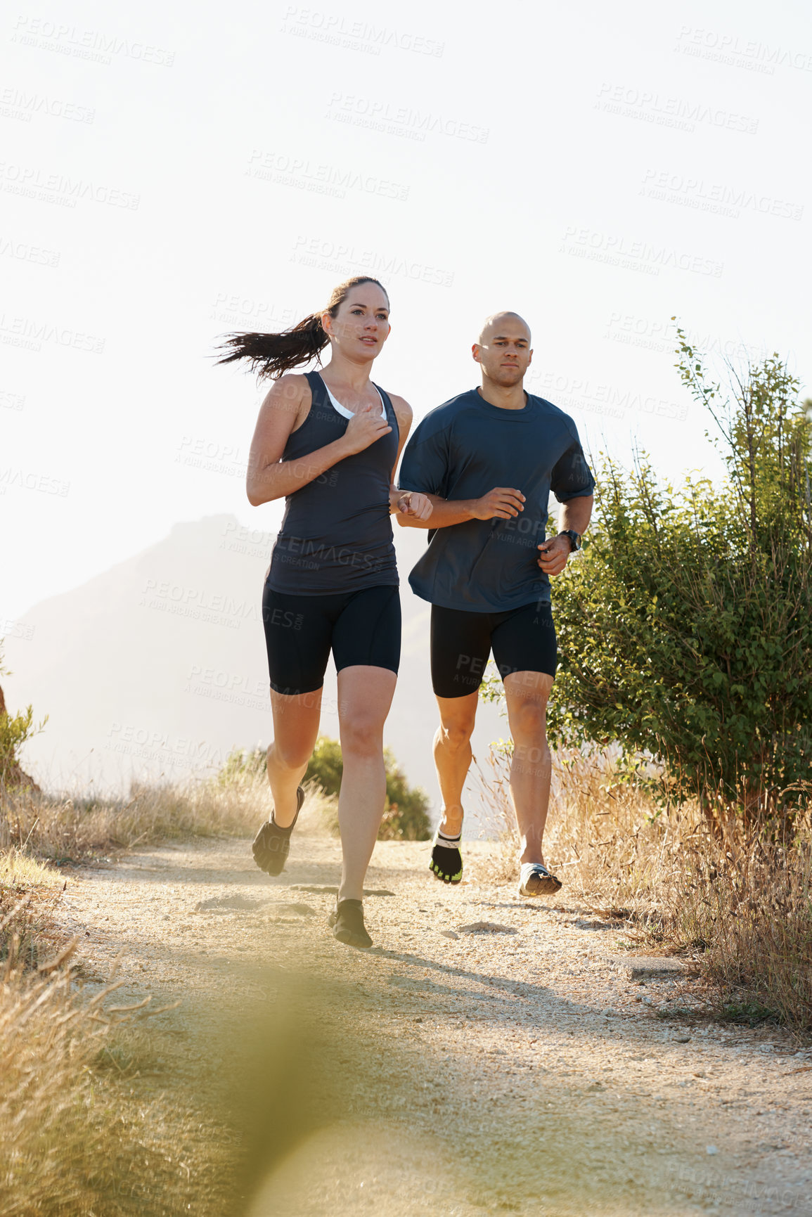 Buy stock photo Morning, fitness and couple trail running as workout or morning exercise for health and wellness together. Sport, man and woman runner run with athlete as training in nature for sports or energy