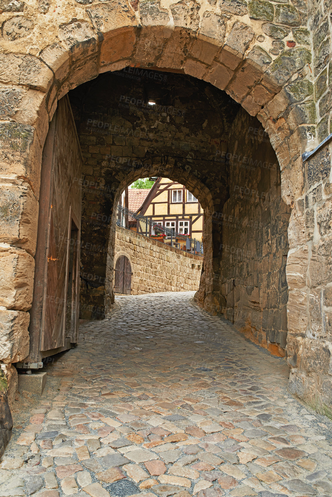 Buy stock photo Arch, path and brick wall with tunnel of ancient passageway, building pattern or exterior architecture. Empty route, concrete trail or historic landmark of secret hallway or hidden outdoor corridor