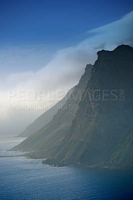 Buy stock photo Mountain, clouds and natural island with ocean, blue sky and calm landscape for travel location. Nature, fog and sustainable environment with earth, sea and holiday destination with tropical summer