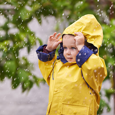 Buy stock photo Happy, boy and rain jacket in winter with thinking for carefree, childhood and enjoyment in Germany. Kid, smile and wondering in nature for vacation, weekend or holiday travel in cold weather