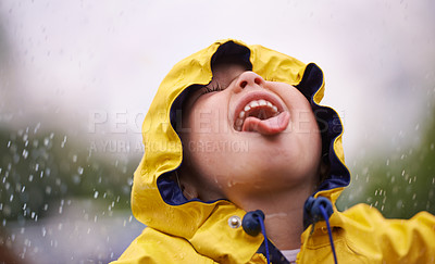 Buy stock photo A little girl having fun in the rain