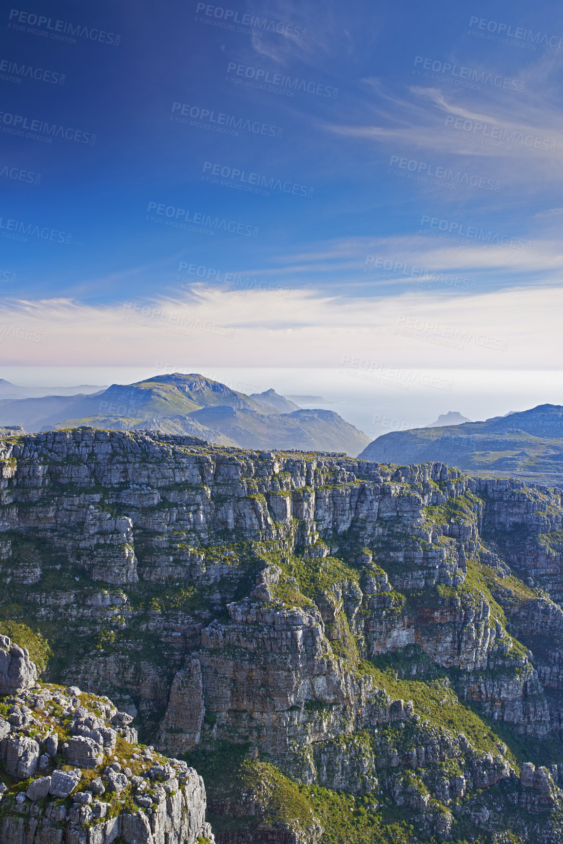 Buy stock photo Mountains, landscape and clouds in sky for travel, hiking or eco friendly tourism by ocean or sea on horizon. Aerial view of environment, nature and rock texture or mockup in Cape Town, South Africa