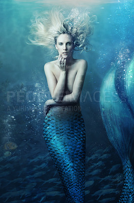 Buy stock photo Shot of a mermaid swimming in solitude in the deep blue sea - ALL design on this image is created from scratch by Yuri Arcurs' team of professionals for this particular photo shoot