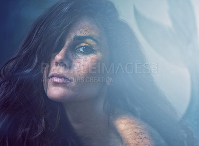 Buy stock photo Mermaid, face and makeup in ocean for beauty, magic or myth for surreal and fantasy. Woman or serious with hair over eye for goddess, fairytale or fiction creature and folklore for mysterious
