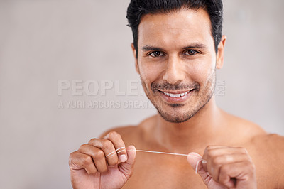 Buy stock photo Dental, portrait and man in bathroom for flossing teeth, self care and morning routine. Oral hygiene, confidence and face of Mexican male person at home for wellness, cleaning and healthy mouth.
