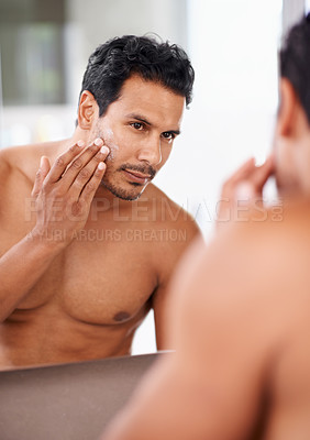 Buy stock photo Skincare, cosmetics and mirror with man in bathroom for morning routine, facial treatment and moisturizer. Self care, confidence and face of male person for sunscreen, lotion or cream in reflection.