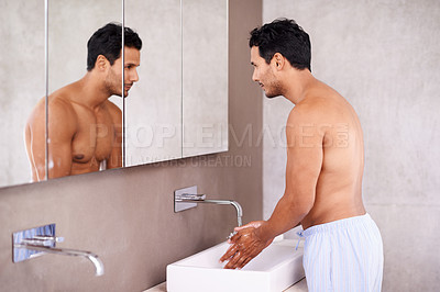 Buy stock photo Washing, skincare and mirror with man in bathroom for facial treatment, bacteria and hygiene. Healthy skin, dermatology and male person for grooming, wellness and morning routine in reflection.
