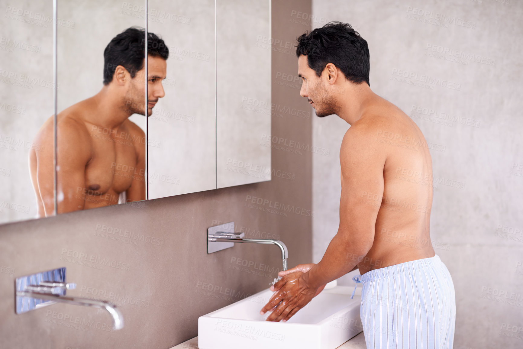 Buy stock photo Washing, skincare and mirror with man in bathroom for facial treatment, bacteria and hygiene. Healthy skin, dermatology and male person for grooming, wellness and morning routine in reflection.