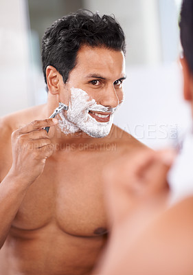 Buy stock photo Man, hair removal and shaving cream on face in bathroom mirror for razor blade, grooming and beauty. Skincare, wellness and male person for self care, morning routine or hygiene with reflection.